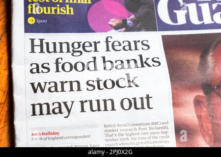 'Hunger fears as food banks warn stock may run out' Guardian newspaper headline cost of living crisis article cutting 31 August 2022 London England UK Stock Photo