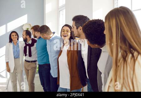 Multiracial team of happy cheerful young business people all together having fun in office Stock Photo