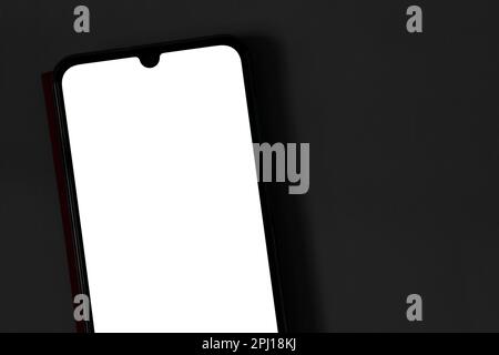 Touch screen phone with white screen on dark background close-up Stock Photo