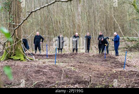 Police search woodland for the remains of  Jason Martin-Smith who was killed over  20 years agho in 2001 aged 28. His body has never been found although hus killer, Mark Searle, was jailed for 29 years for his murder.Battle, East sussex. Multiple police officers have been investigating in fields close to Marley Lane in Battle with a blue tent erected by the side of the site. 30th March 2023  The murder of the victim, which took place in 2001, has been solved, but police have been unable to find the whereabouts of the body. Stock Photo