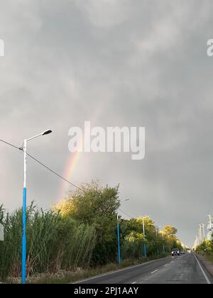 colorful rainbow after summer storm Stock Photo - Alamy
