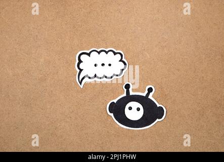 Bot on chat, bot symbol. Concept of AI, hand drawn bot representation in a chat bubble ready to work Stock Photo