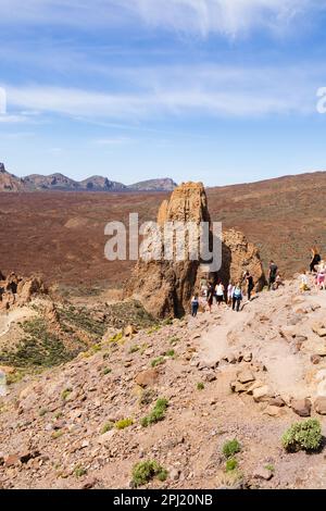 Tourists at The Roques de Garcia in the Mount Teide national park on the slopes of the volcano. Santa Cruz de Tenerife, Canary Islands,Spain Stock Photo