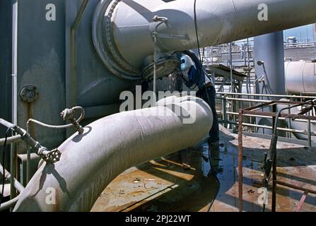 Saudi Arabia El Khobar Man Welding at  Desalination Plant Stock Photo