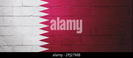 Flag of Qatar painted on a cinder block wall. Stock Photo