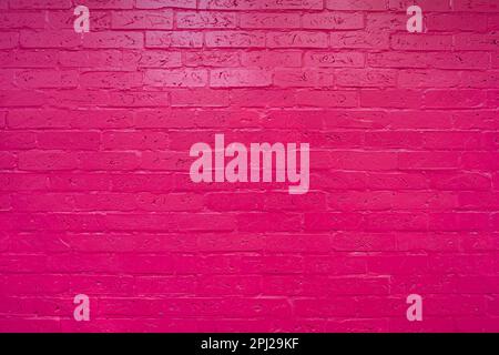 Frontal view of a pink brick wall without people. Colored modern background. Stock Photo