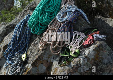 Different ropes and other climbing equipment on rock outdoors Stock ...