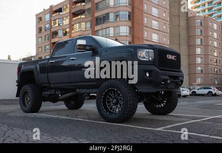 GMC Denali truck parked on a street. Black truck at the city-Vancouver BC Canada-January 10,2023-Street photo, nobody, editorial Stock Photo