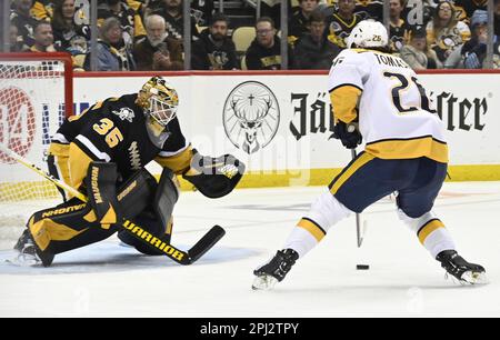 Nashville Predators' Philip Tomasino (26) Tries To Get The Puck Away ...