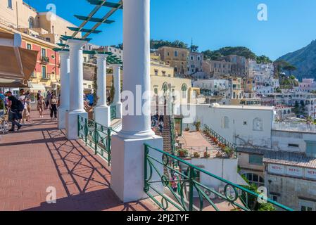 Capri, Italy, May 20, 2022: People are enjoying view over Capri from the balcony next to the main square, Italy. Stock Photo