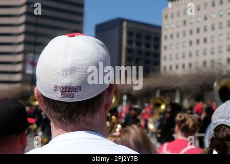 CINCINNATI, OH - MARCH 30: A Cincinnati Reds fan watches the Findlay Market  Opening Day Parade on March 30, 2023, in Cincinnati, OH. (Photo by Ian  Johnson/Icon Sportswire) (Icon Sportswire via AP