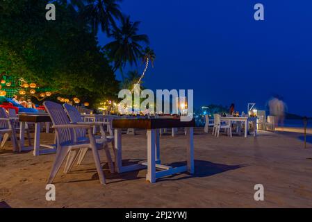 Mirissa, Sri Lanka, January 22, 2022: Sunset view of a beach restaurant at Mirissa beach, Sri Lanka. Stock Photo