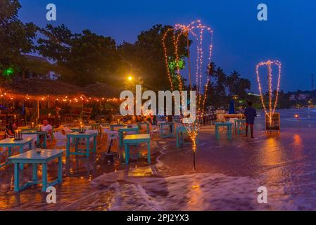 Mirissa, Sri Lanka, January 22, 2022: Sunset view of a beach restaurant at Mirissa beach, Sri Lanka. Stock Photo