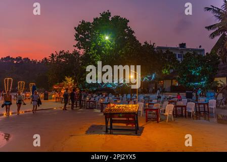 Mirissa, Sri Lanka, January 22, 2022: Sunset view of a beach restaurant at Mirissa beach, Sri Lanka. Stock Photo