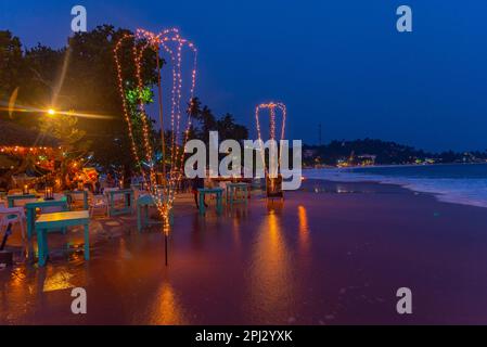 Mirissa, Sri Lanka, January 22, 2022: Sunset view of a beach restaurant at Mirissa beach, Sri Lanka. Stock Photo