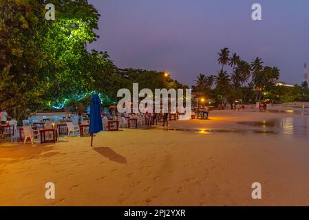 Mirissa, Sri Lanka, January 22, 2022: Sunset view of a beach restaurant at Mirissa beach, Sri Lanka. Stock Photo