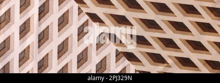 Fabric is cotton beige brown in rhombuses closeup Stock Photo