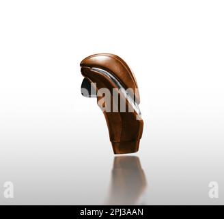 Brown leather car gear knob isolated with chrome stripe and push button release on white background with reflection, Clipping path included. Stock Photo
