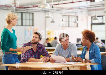 Creativity in process. a group of colleagues collaborating with each other on a project in an office. Stock Photo