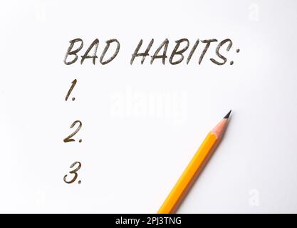 List of bad habits and pencil on white paper, top view. Change your lifestyle Stock Photo