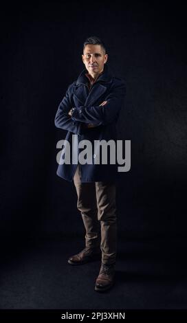 Portrait of confident caucasian man in casual clothes with his arms crossed Stock Photo