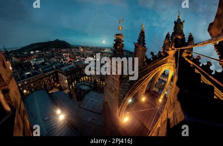 From the rooftop of St Giles' Cathedral, the High Kirk of Edinburgh, Scotland, looking over teh city from near the Royal Mile as evening arrives. Stock Photo