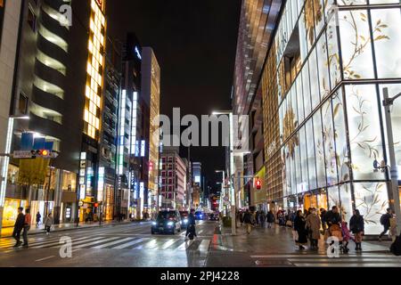 Evening view along futuristic shopping street in Ginza shopping district, Tokyo, Japan Stock Photo