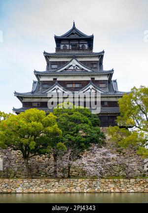 Exterior view of Hiroshima Castle in cherry blossom season, Hiroshima , Japan Stock Photo