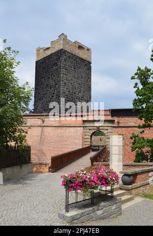 Czech Republic, Cheb:  the Black Tower, rising above the  walls of the castle which dates back to Emperor Frederick 1 Barbarossa in 1179.  Built of Bl Stock Photo