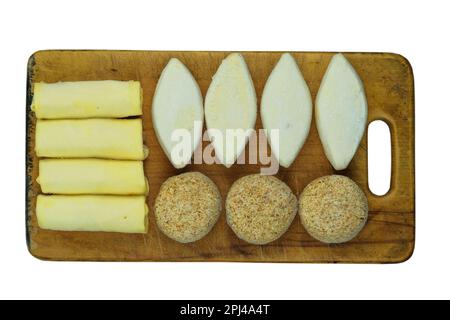 Assorted homemade semi-finished products on wooden boardes. Frozen cutlets, pancakes. Preparations of homemade food. Stock Photo