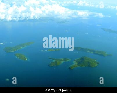 Philippine Archipelago:  aerial view of a group of small, wooded islands, apparently uninhabited. Stock Photo