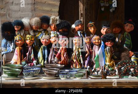 Uzbekistan, Province Khorezm, Khiva, a walled, desert city founded about the beginning of the millennium:  traditional Uzbek puppets on a souvenir sta Stock Photo