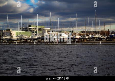 Tallinn Yacht Club during the winter months when the harbor is frozen. The boats are winterized and covered up. Stock Photo