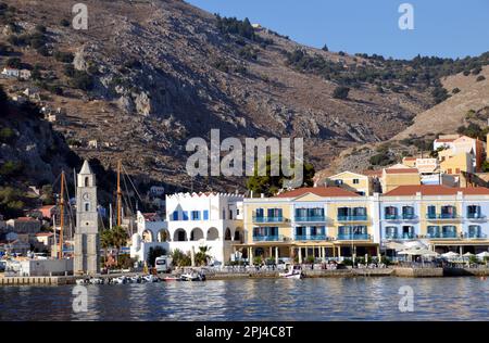 Greece, Island of Symi, Gialos:  the clocktower, built in 1881, on the point, separating the two bays. Stock Photo