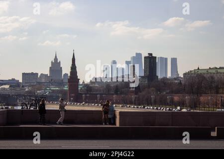 Moscow, Russia. 28th Mar, 2023. People take photos on the Bolshoy Moskvoretsky Bridge. Credit: SOPA Images Limited/Alamy Live News Stock Photo