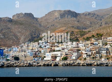 Greece, Island of Kalymnos, Pothia:  the town, sheltering under the mountains, has grown up around the harbour. Stock Photo