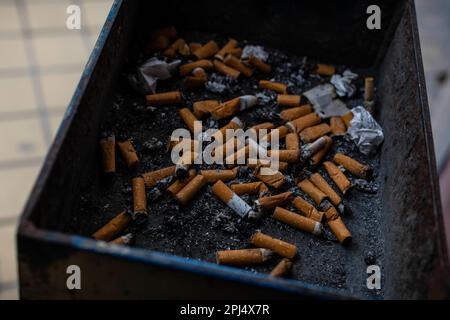 Cigarette butts in tray Stock Photo