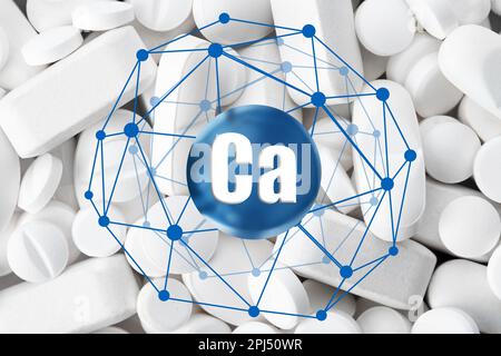 Calcium supplement pills as background, closeup view Stock Photo