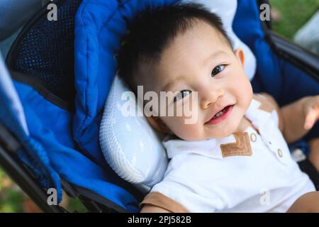 Portrait of cheerful son travel with family on holiday weekend Stock Photo