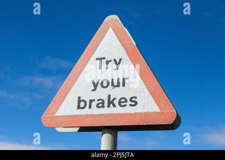 Try your brakes road sign after a river ford Stock Photo