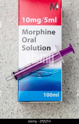 A close up of a box of Morphine Oral Solution with a Oral Syringe Stock Photo