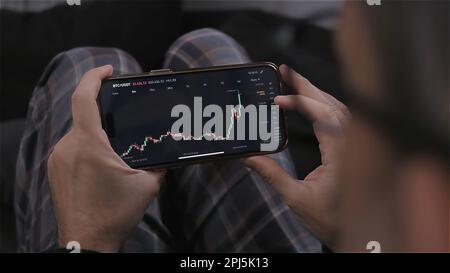 trader using technical analysis at stock market candlestick patterns - analyzing market trends  Stock Photo