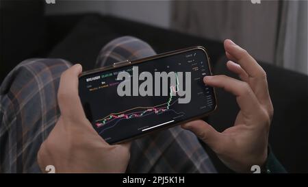 trader using technical analysis at stock market candlestick patterns - analyzing market trends  Stock Photo