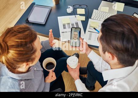 Business colleagues having video call discussing financial data working together in office. People entrepreneurs working with charts and tables on com Stock Photo