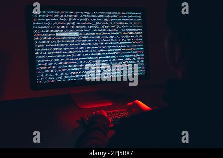 Man using computer and programming  to break code. Cyber security threat. Internet and network security. Stealing private information. Person using te Stock Photo