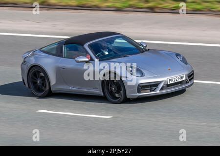 2022 (22) plate Silver Porsche 911 Targa 4 GTS; travelling on the M61 motorway, UK Stock Photo