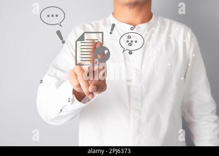 Businessman touching document checklist icon. Search and manage document database files. Document management system concept. Stock Photo