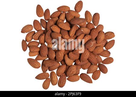 Heap of scattered organic almonds isolated on white background Stock Photo
