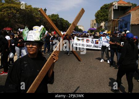 Maracaibo, Venezuela. 30th Mar, 2023. Teachers, pensioners, the health sector and retirees march in protest to the State Governor's Office demanding better wages in Maracaibo, Venezuela, on March 30, 2023.More than 8 regional Unions participated in the demonstration, called “Worker's Via Crucis” as a prelude to the Easter holiday. (Photo by Humberto Matheus/Sipa USA) Credit: Sipa USA/Alamy Live News Stock Photo