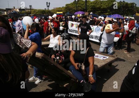 Maracaibo, Venezuela. 30th Mar, 2023. Teachers, pensioners, the health sector and retirees march in protest to the State Governor's Office demanding better wages in Maracaibo, Venezuela, on March 30, 2023.More than 8 regional Unions participated in the demonstration, called “Worker's Via Crucis” as a prelude to the Easter holiday. (Photo by Humberto Matheus/Sipa USA) Credit: Sipa USA/Alamy Live News Stock Photo